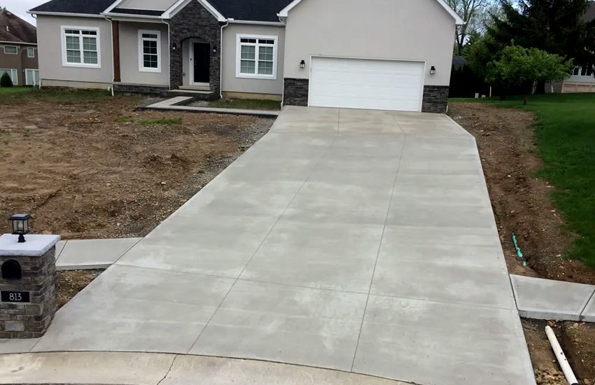 Broom-finish concrete driveway installed by LU Concrete in Lakeville, MN