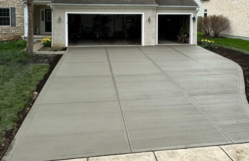 Broom-finish concrete driveway installed by LU Concrete in Burnsville, MN